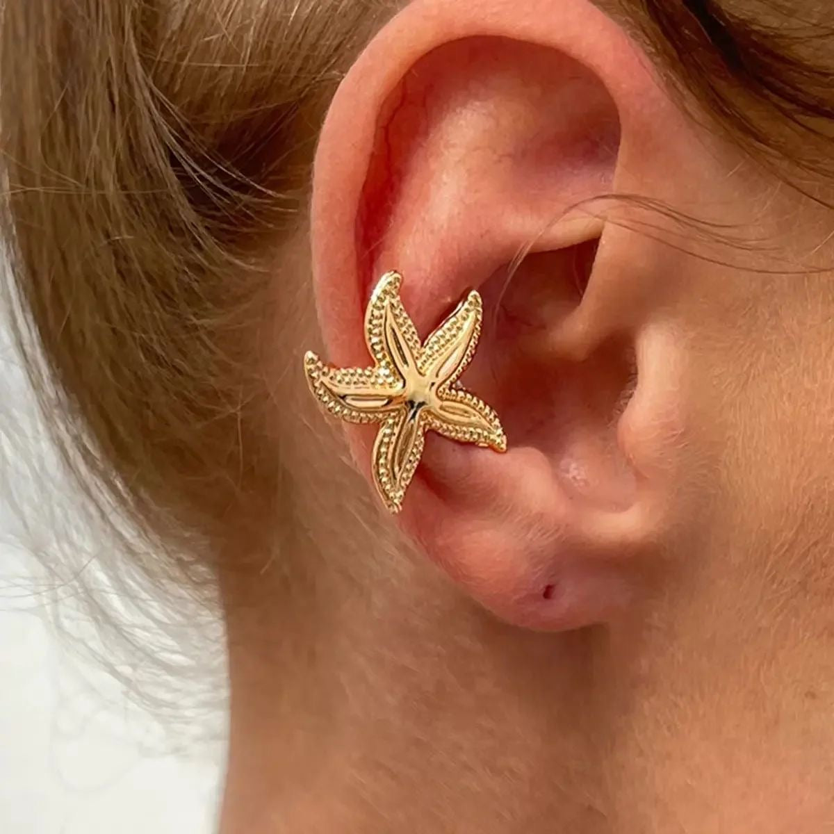 Fake starfish piercing